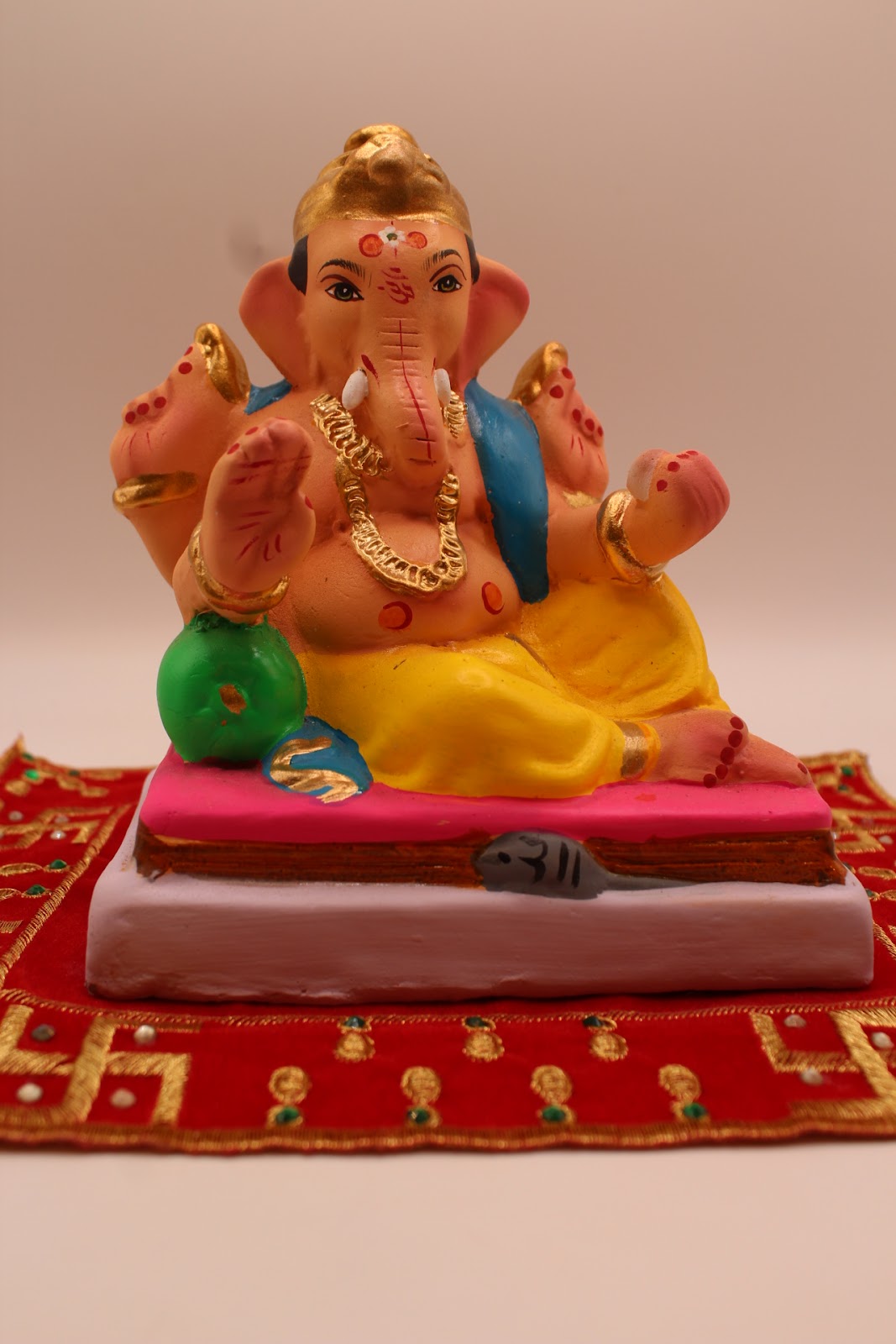 Eco-friendly 6 inch Ganesh idol, blue khes and yellow dhoti, front view