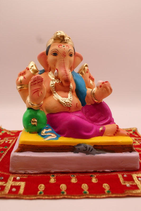 Eco-friendly 6 inch Ganesh idol, blue khes and magenta dhoti, front view
