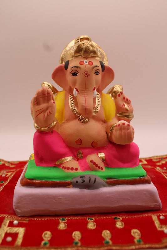 Eco-friendly 6 inch Ganesh idol, yellow khes and rani pink dhoti, front view