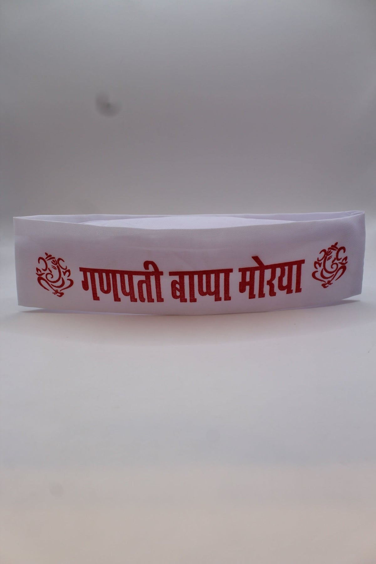 Gandhi topi with Ganpati Bappa Morya print, front view