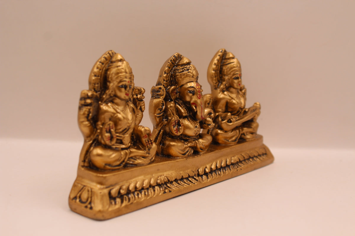 Antique gold Ganesh Laxmi Saraswati resin murti trio, left side view