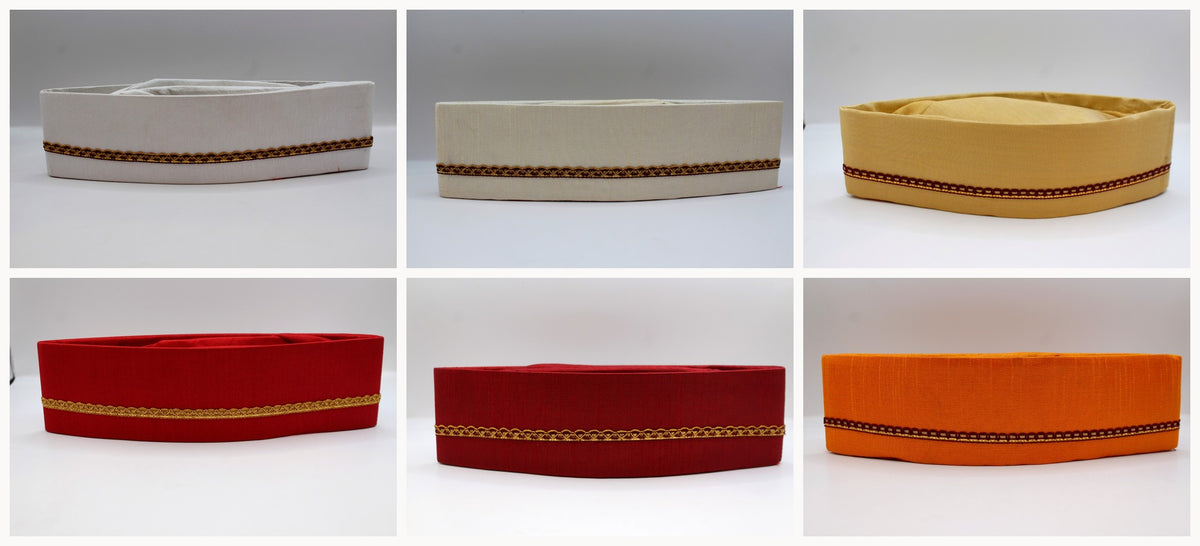 All six Gandhi topi colours side by side — white, off-white, champagne gold, red, maroon and saffron