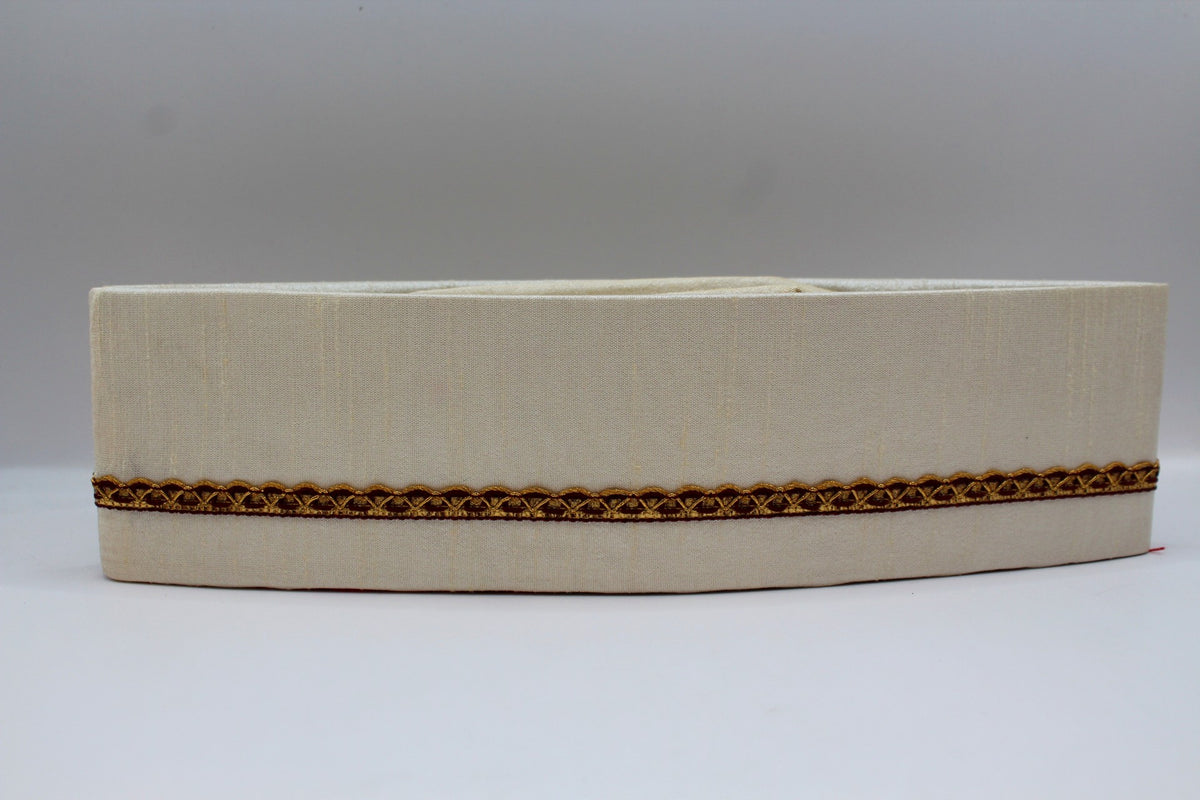 Off-white Gandhi topi with maroon and gold border, front view