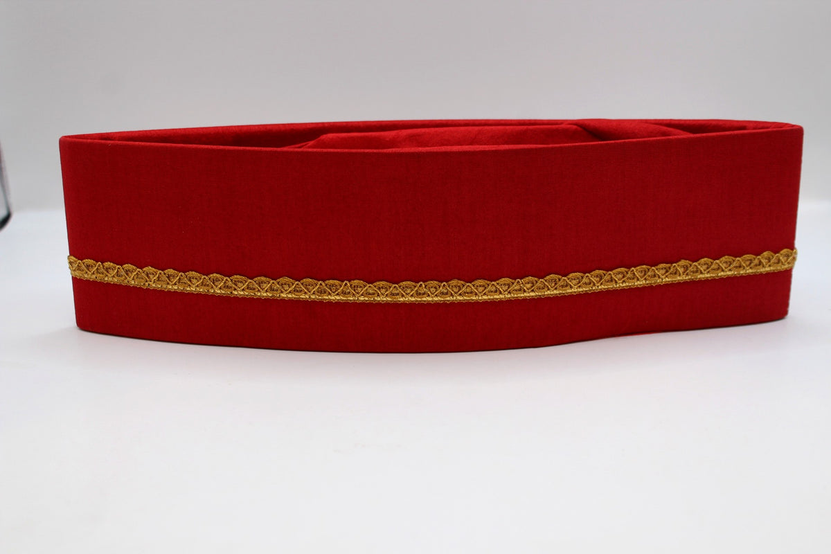 Red Gandhi topi with golden border, front view