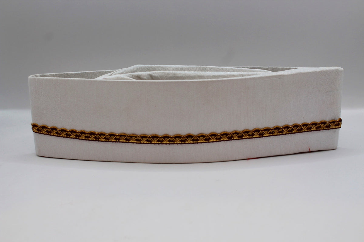 White Gandhi topi with maroon and gold border, front view