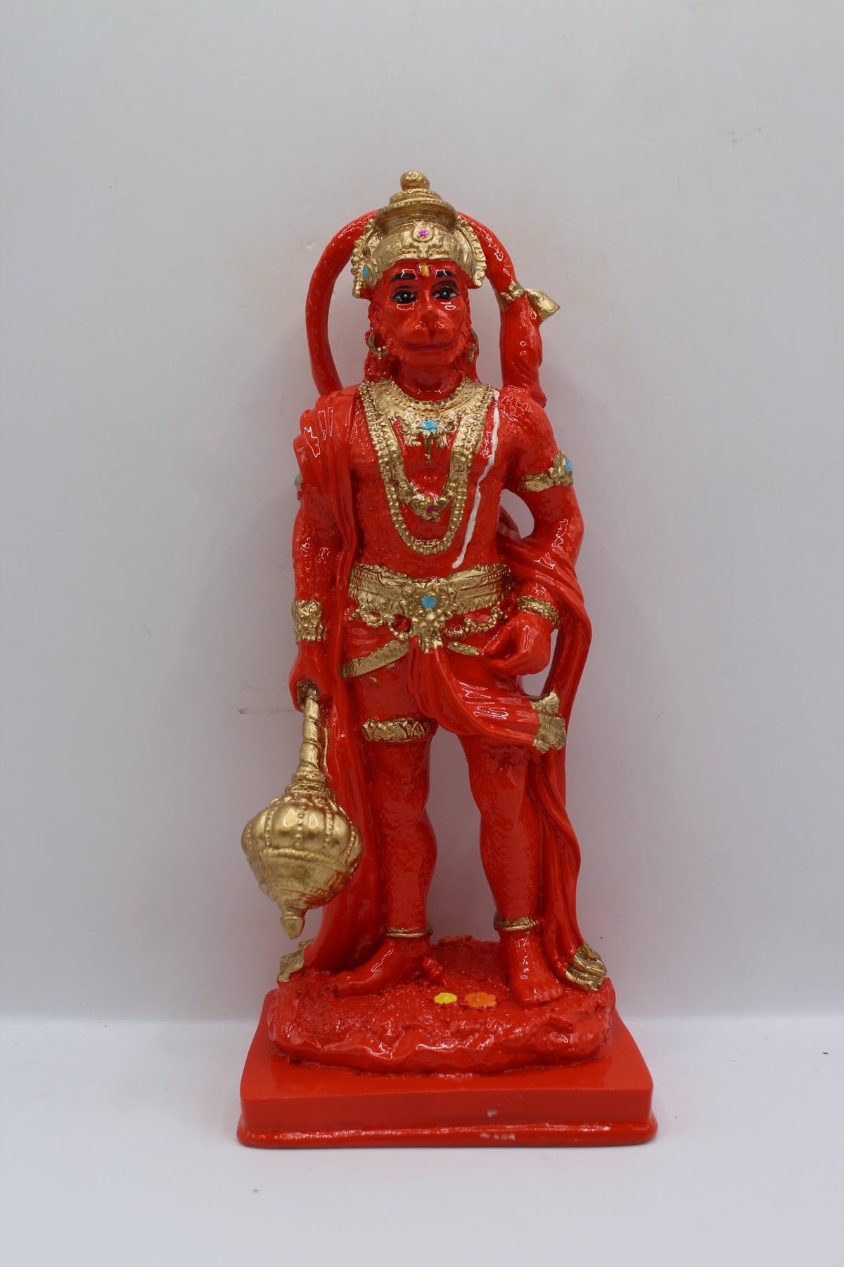 Orange resin Hanuman murti standing with gada, front view