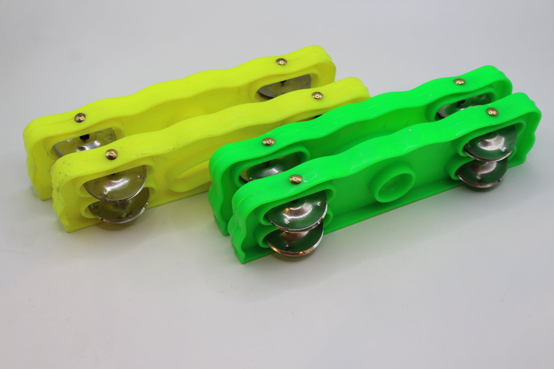 Plastic kartal manjeera twin sets in green and yellow