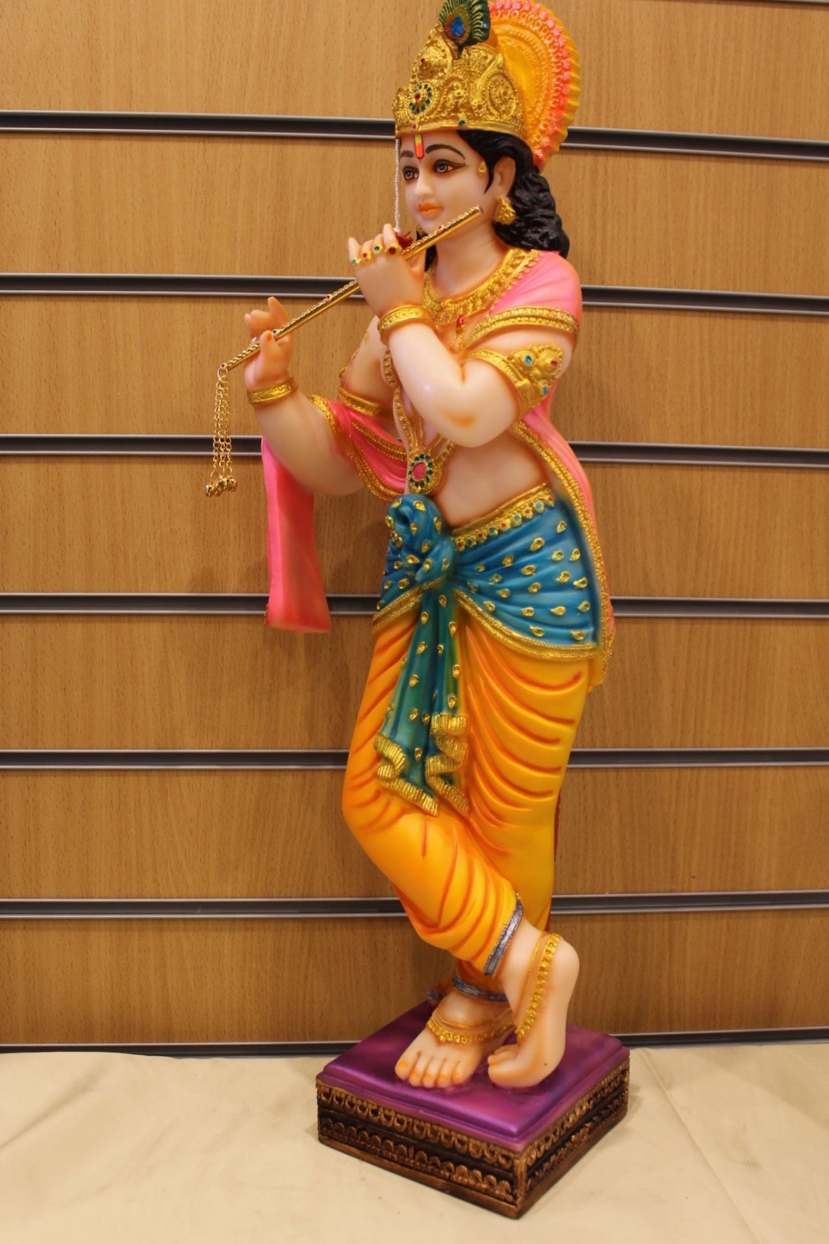 Resin/Fibre Krishna Statue for Home Temple – Playing Flute, 25 inch – Orange & Teal – right side view