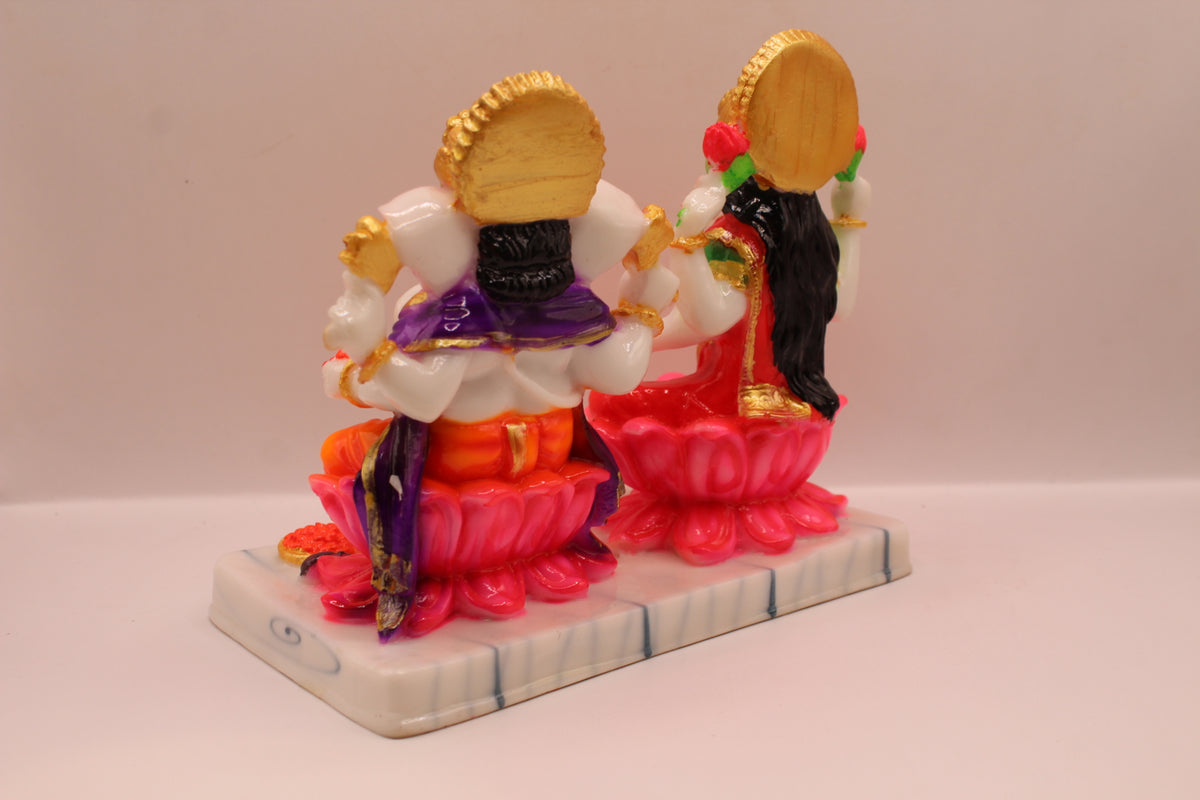 Resin Laxmi Ganesh murti pair on lotus seats with white base, back view