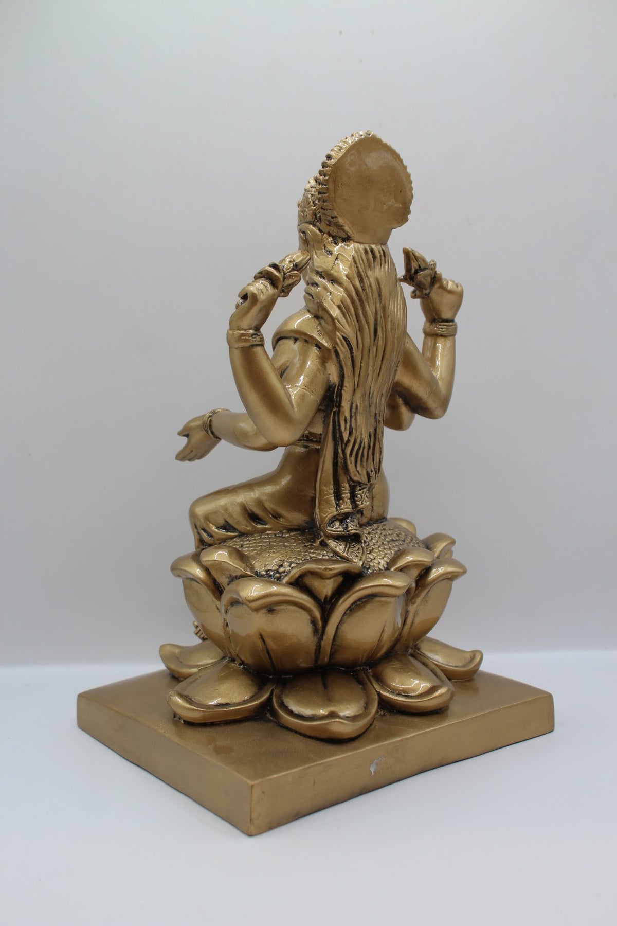 Antique gold resin Laxmi murti on a lotus, back view