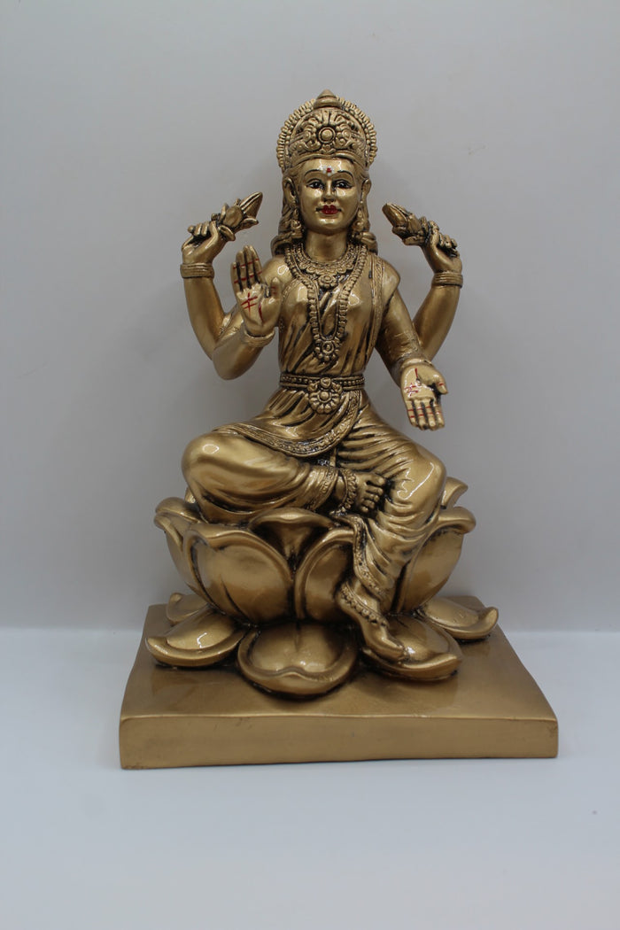 Antique gold resin Laxmi murti on a lotus, front view