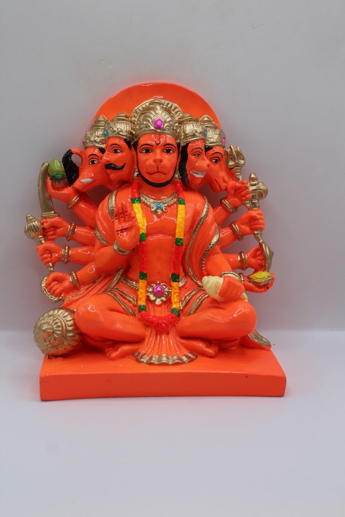 Orange resin Panchmukhi Hanuman murti, seated, front view