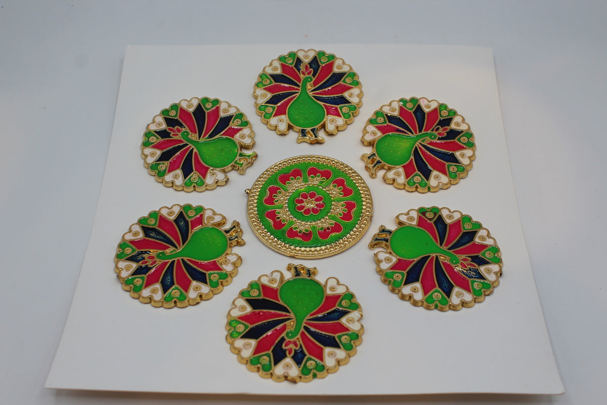 Rangoli stickers, red, green and black peacock flower design – close-up