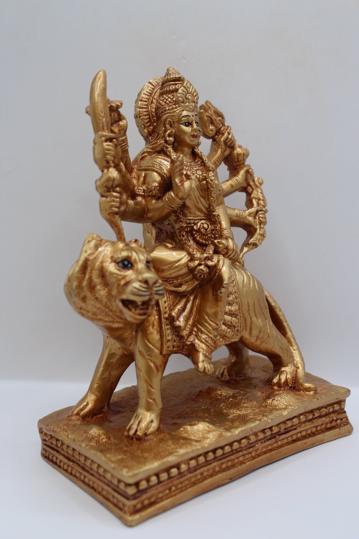 Resin Ambe Maa statue, golden finish, flat base, left side view