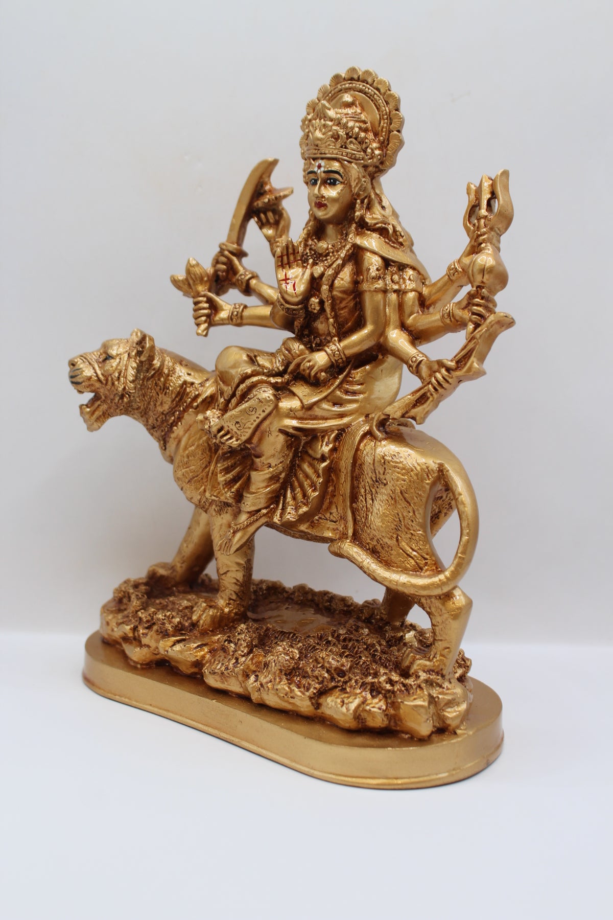 Resin Ambe Maa statue, golden finish, oval base, right side view