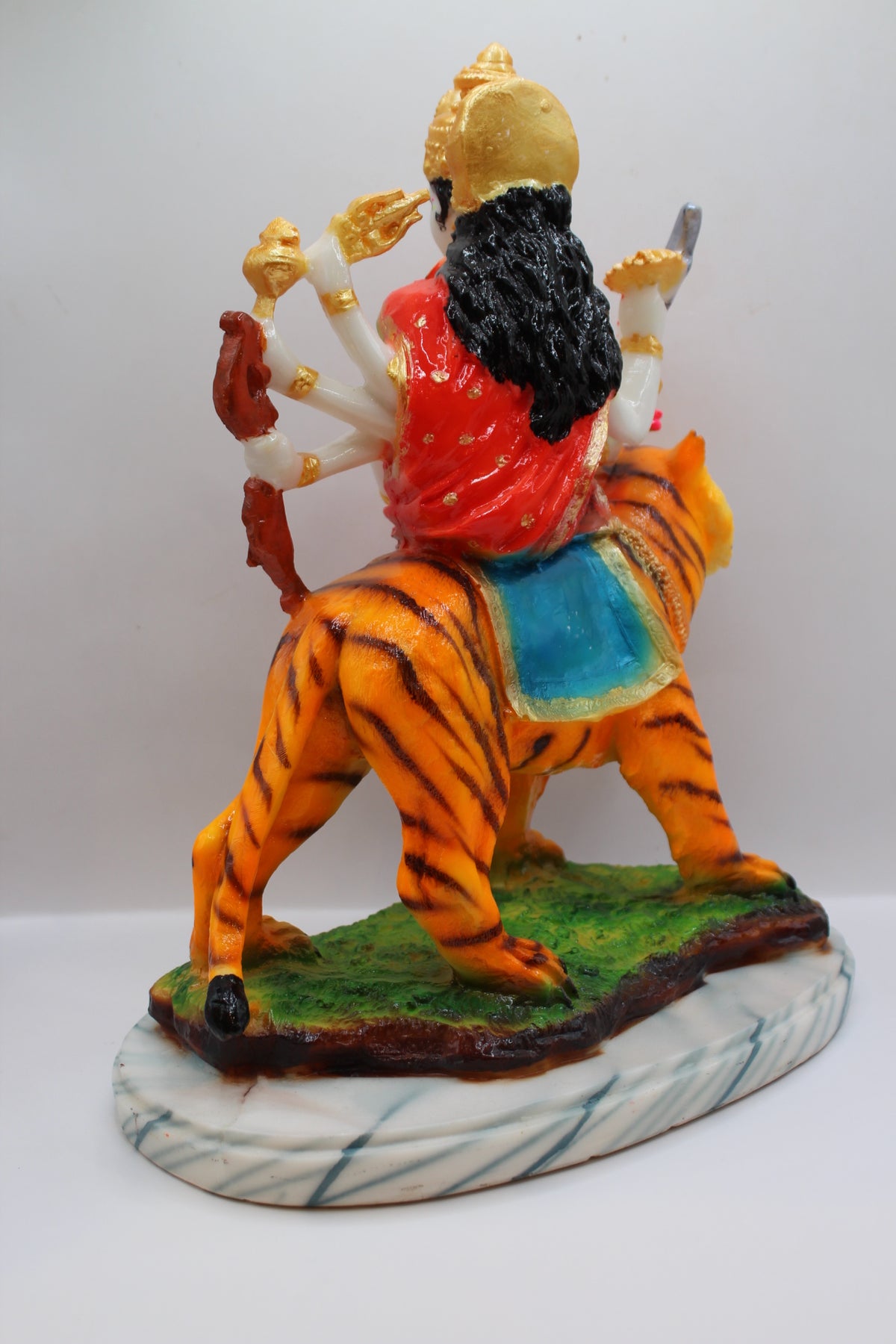 Resin Ambe Maa statue, red dress on tiger, green base, back view