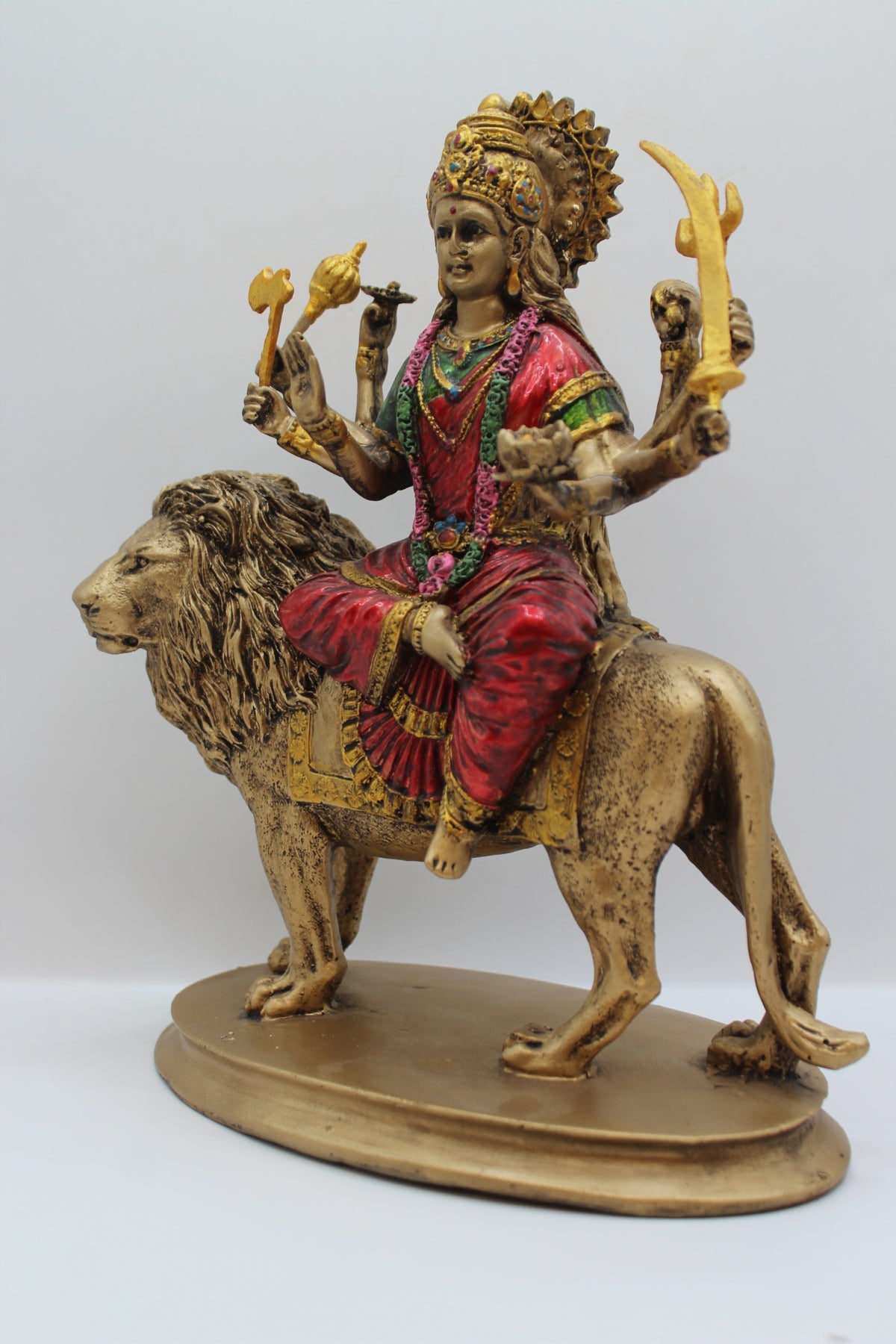 Resin Ambe Maa statue, seated on lion, antique bronze, right side view