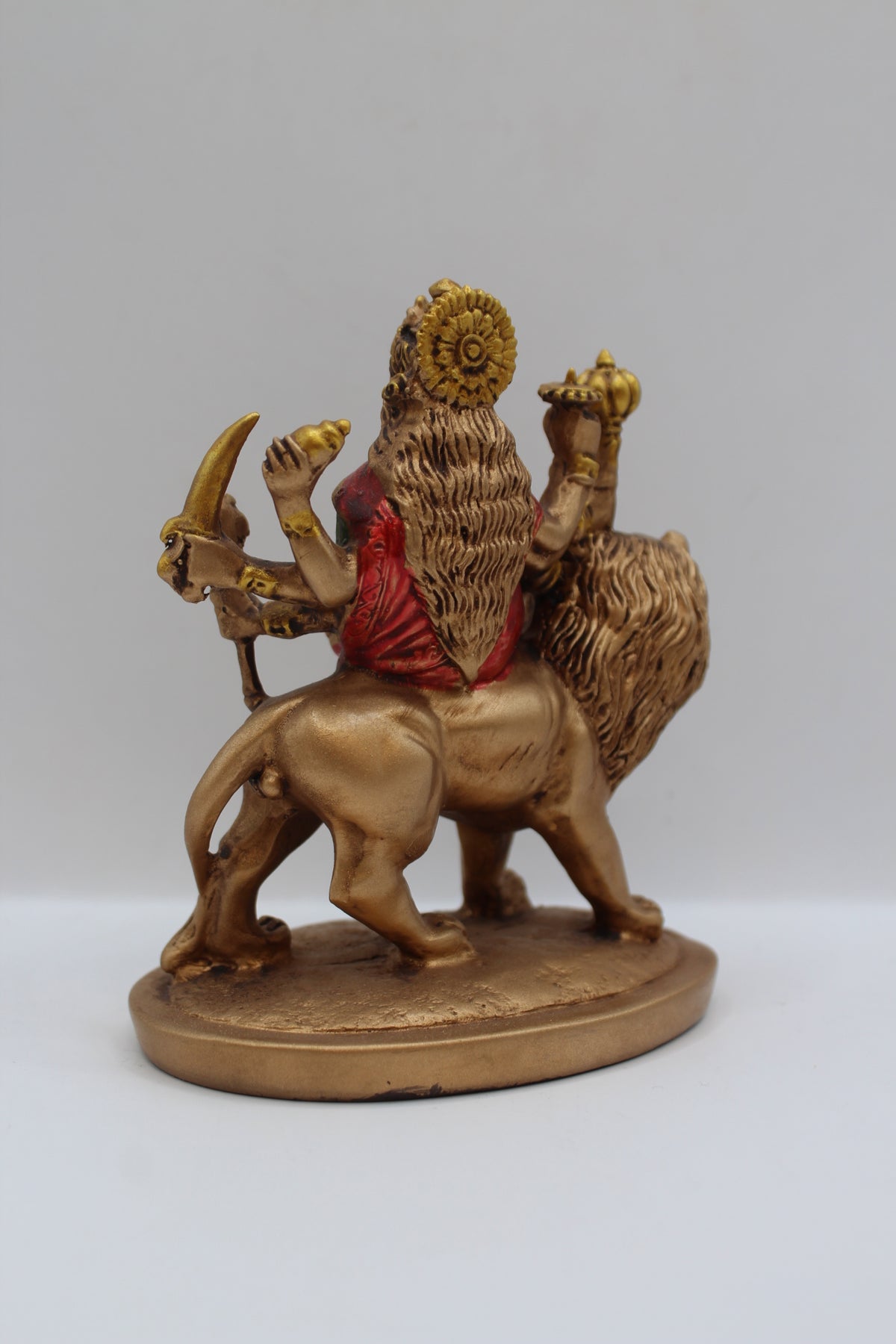 Resin Ambe Maa statue, seated on lion, antique bronze, back view