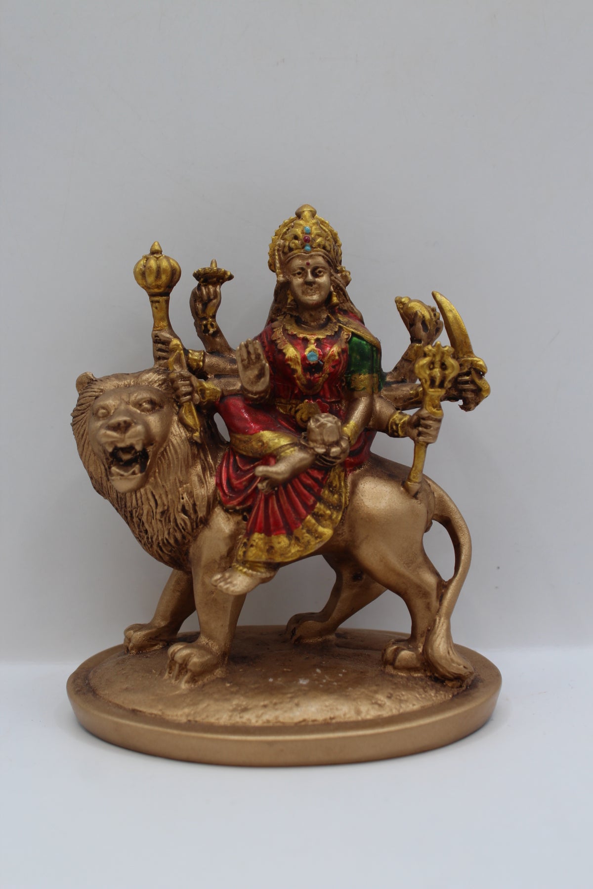 Resin Ambe Maa statue, seated on lion, antique bronze, front view