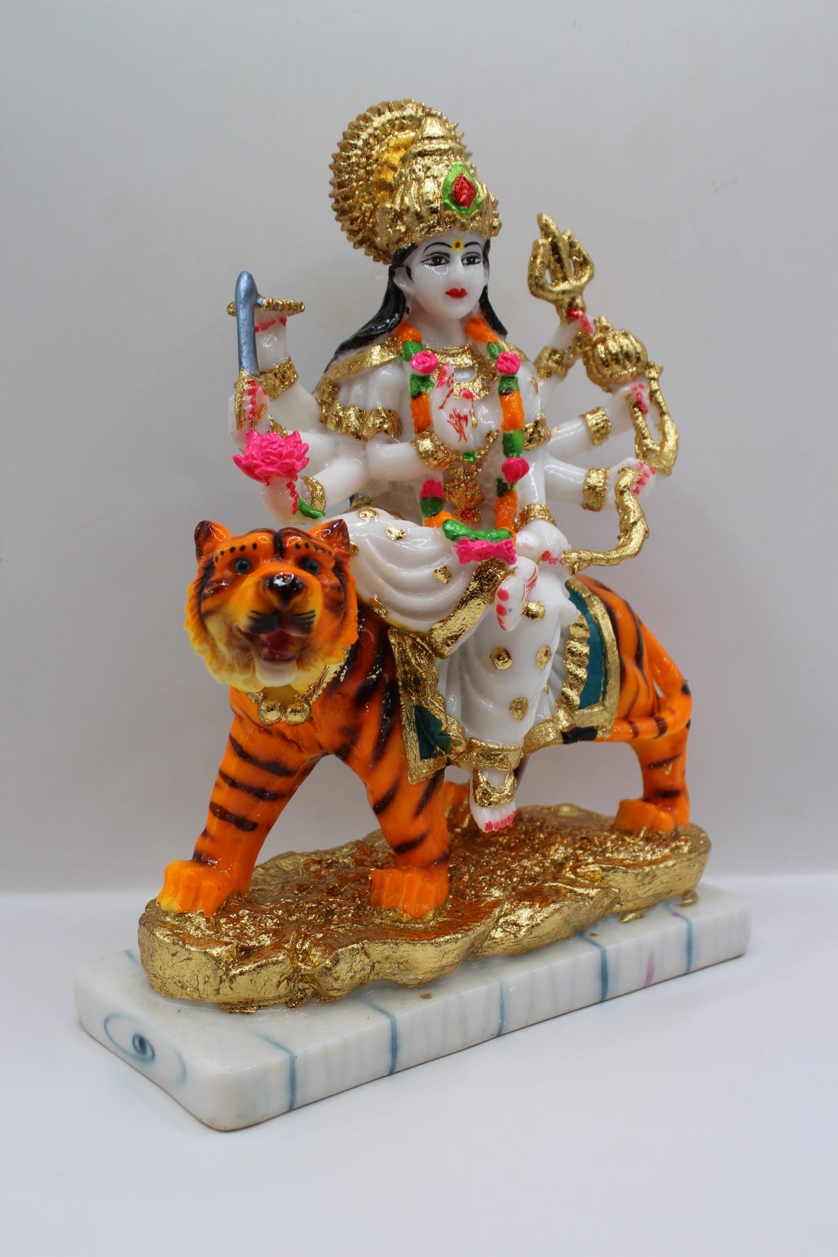 Resin Ambe Maa statue, white dress on tiger, gold base, left side view