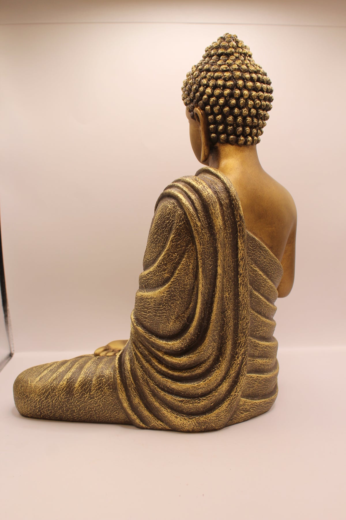 Antique gold Buddha statue, back