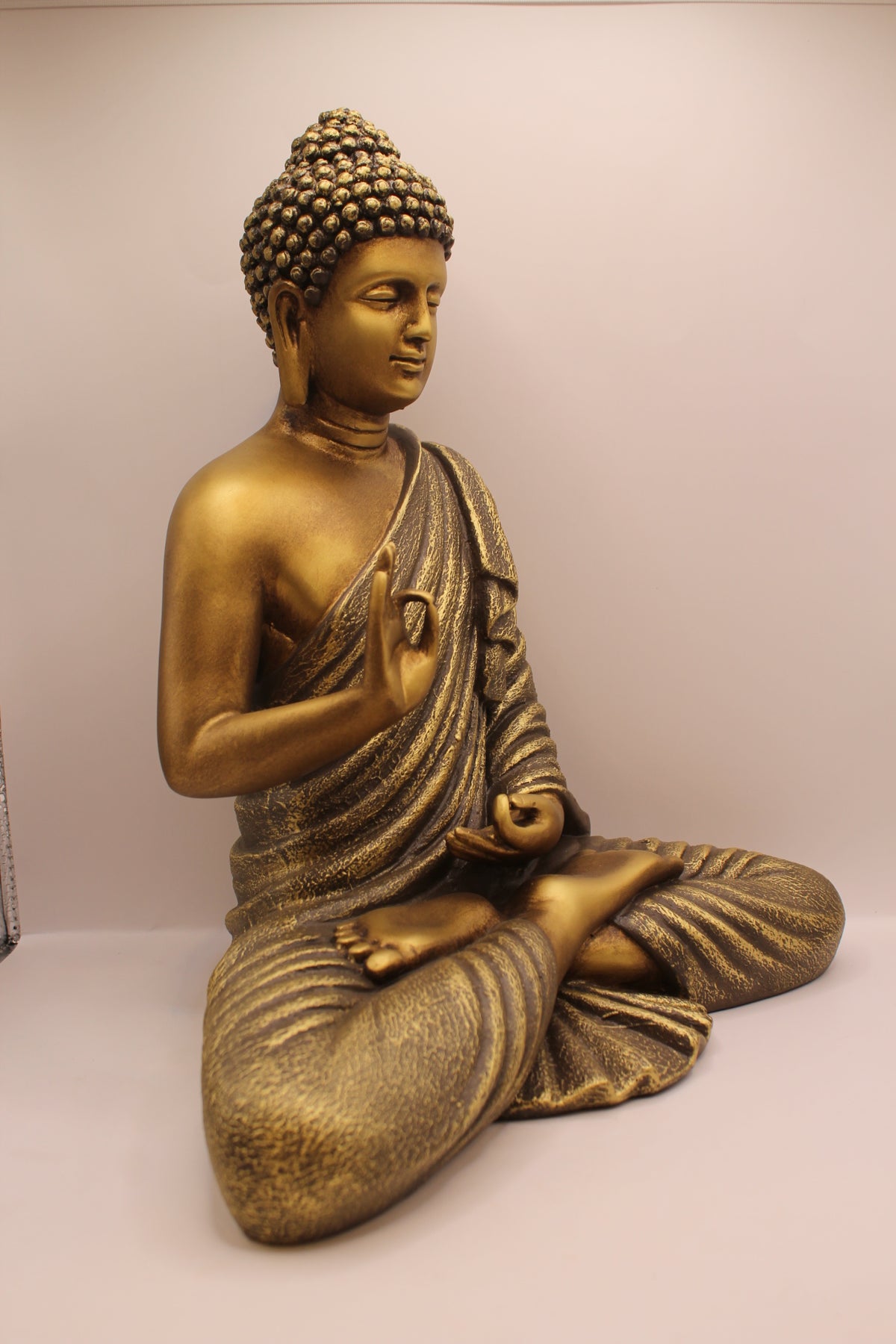 Antique gold Buddha statue, left side