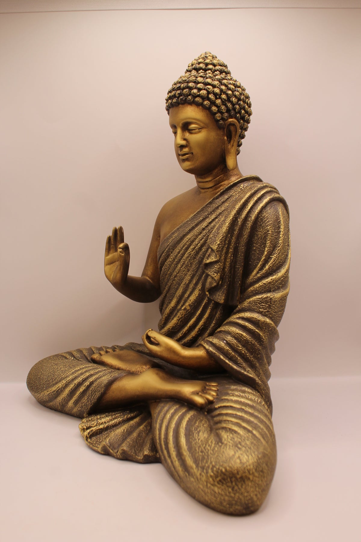 Antique gold Buddha statue, right side