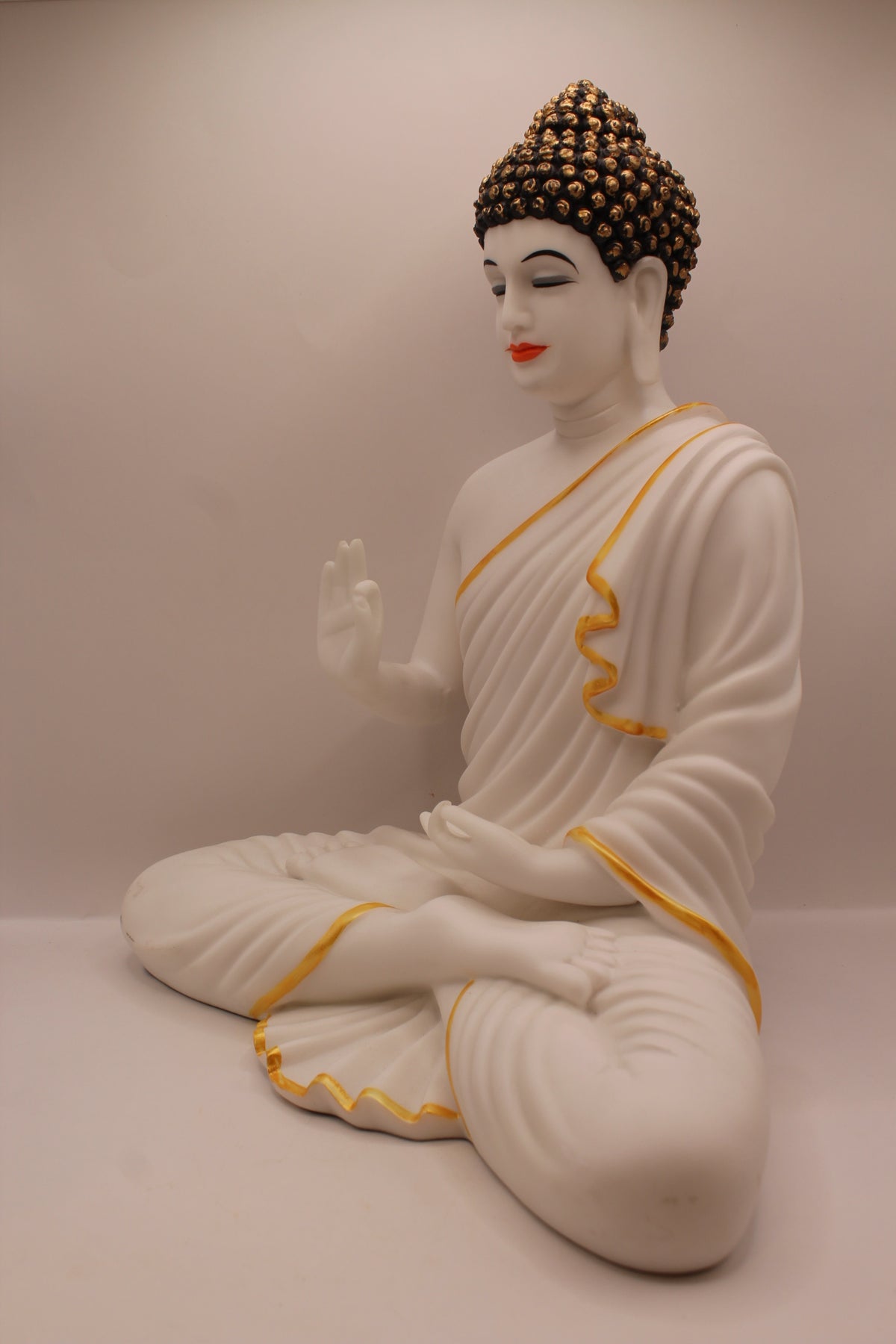 Matte white Buddha statue, right side