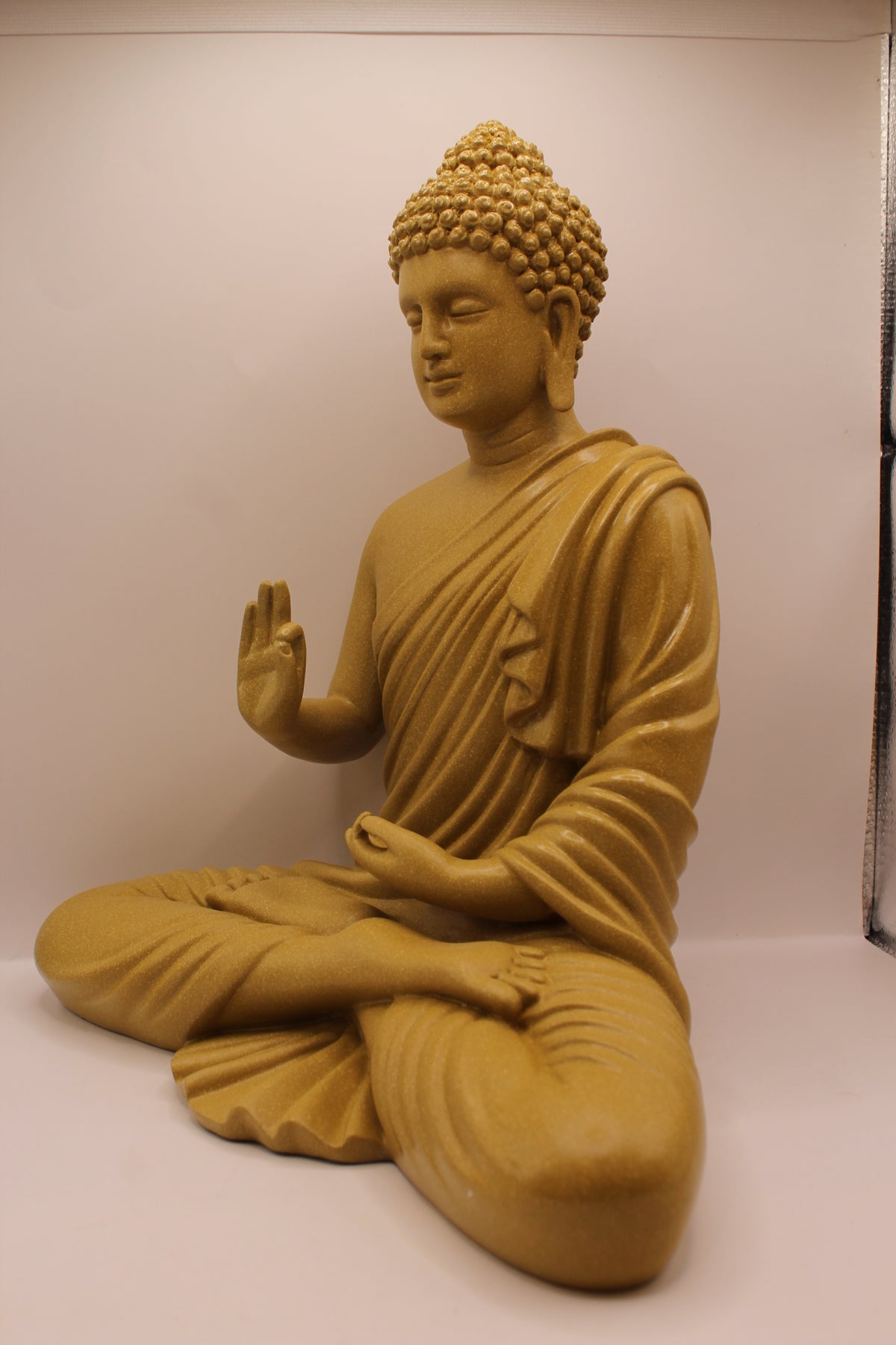 Mustard yellow Buddha statue, right side