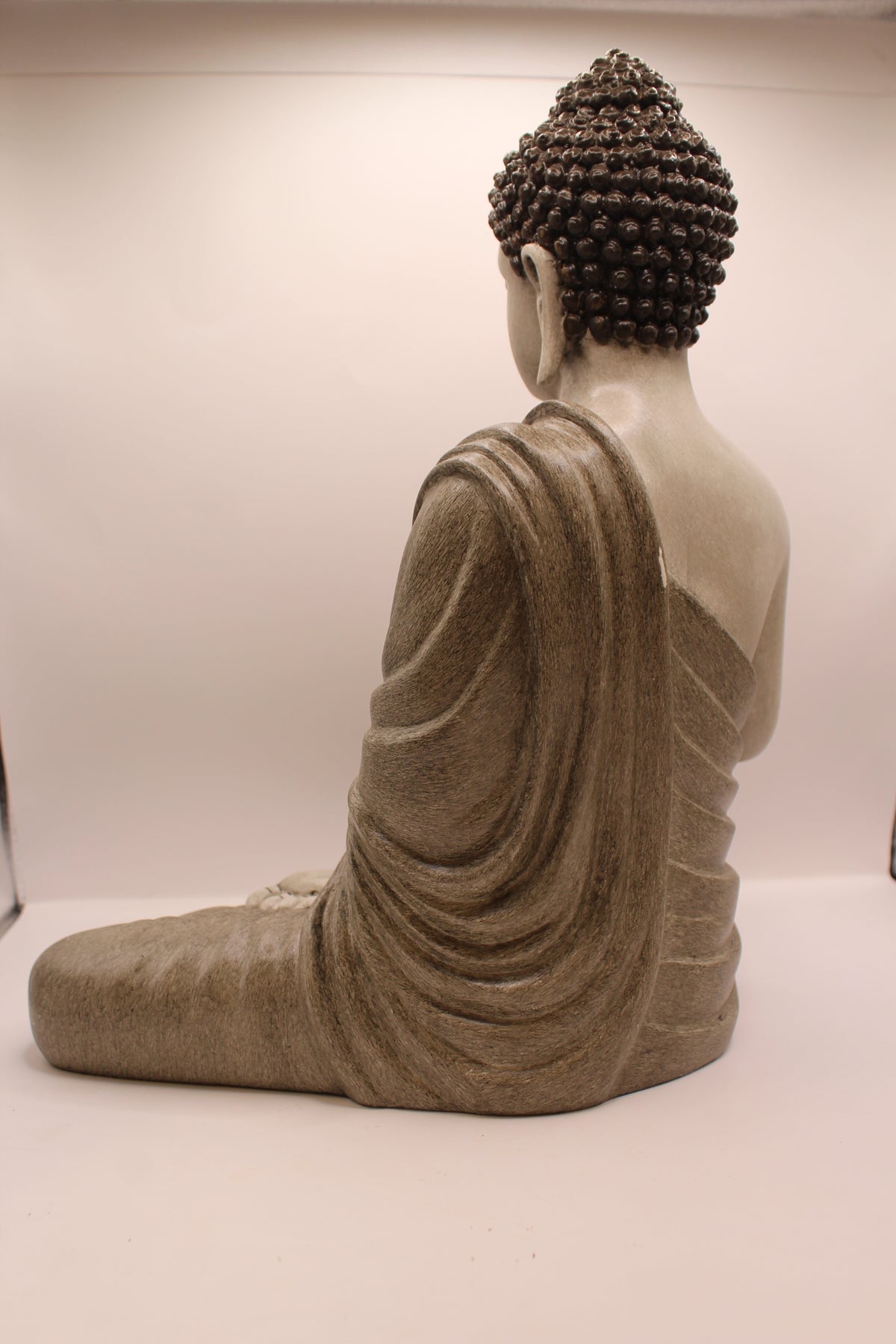 Slate grey Buddha statue, back