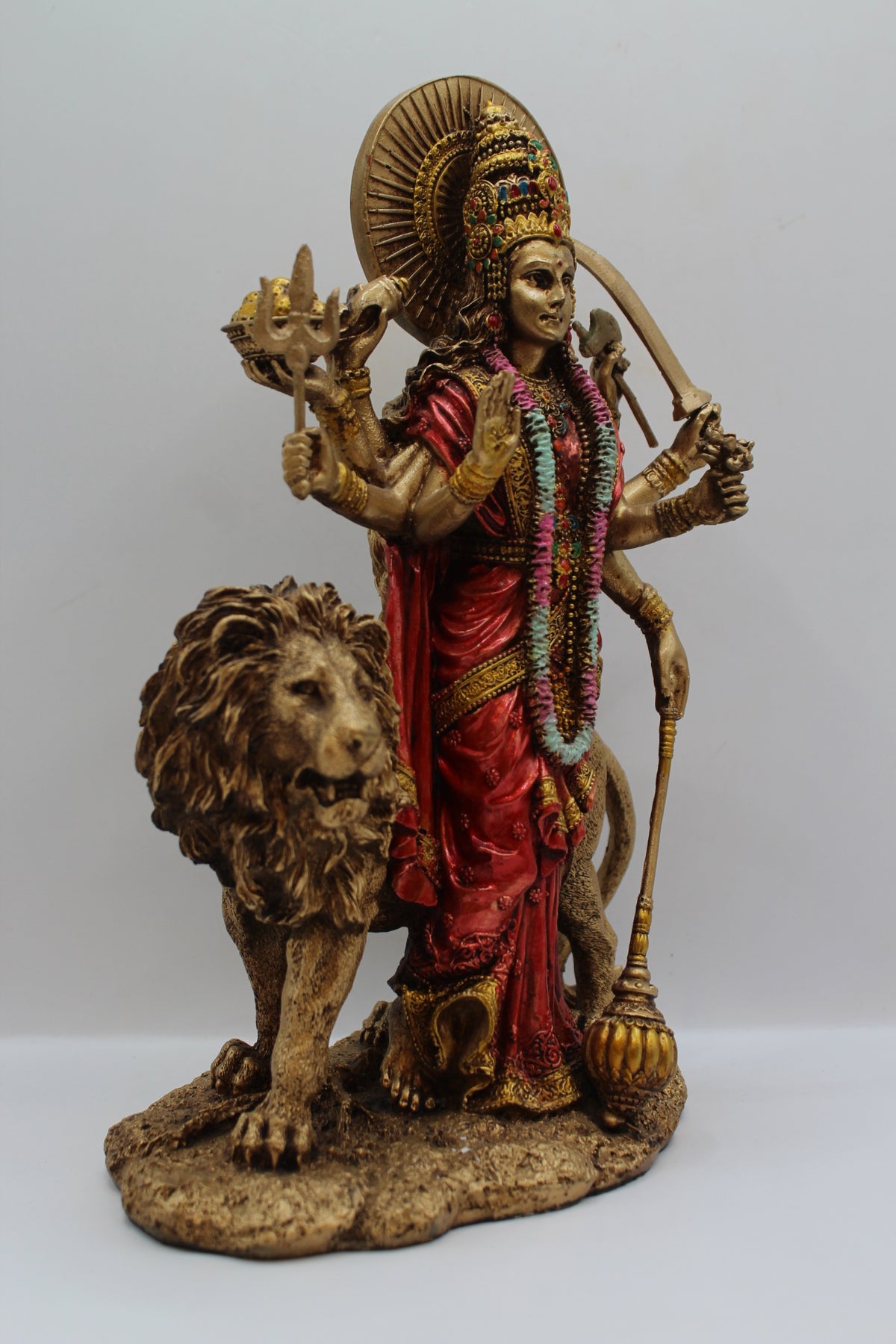 Resin Durga Maa statue, standing with lion, antique bronze, left side view