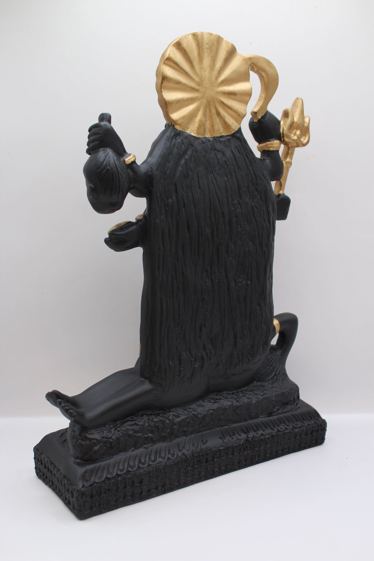 Resin Kali Mata statue, black and gold, standing, back view