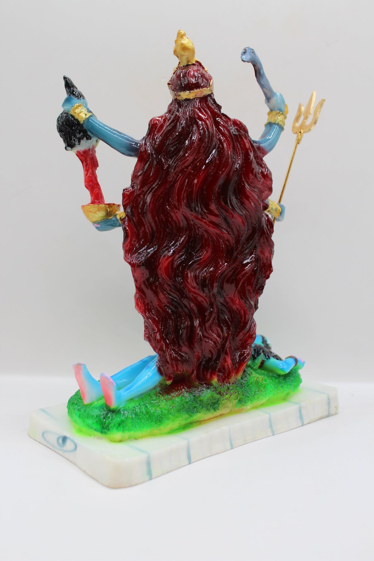 Resin Kali Mata statue, blue kali on green base, back view
