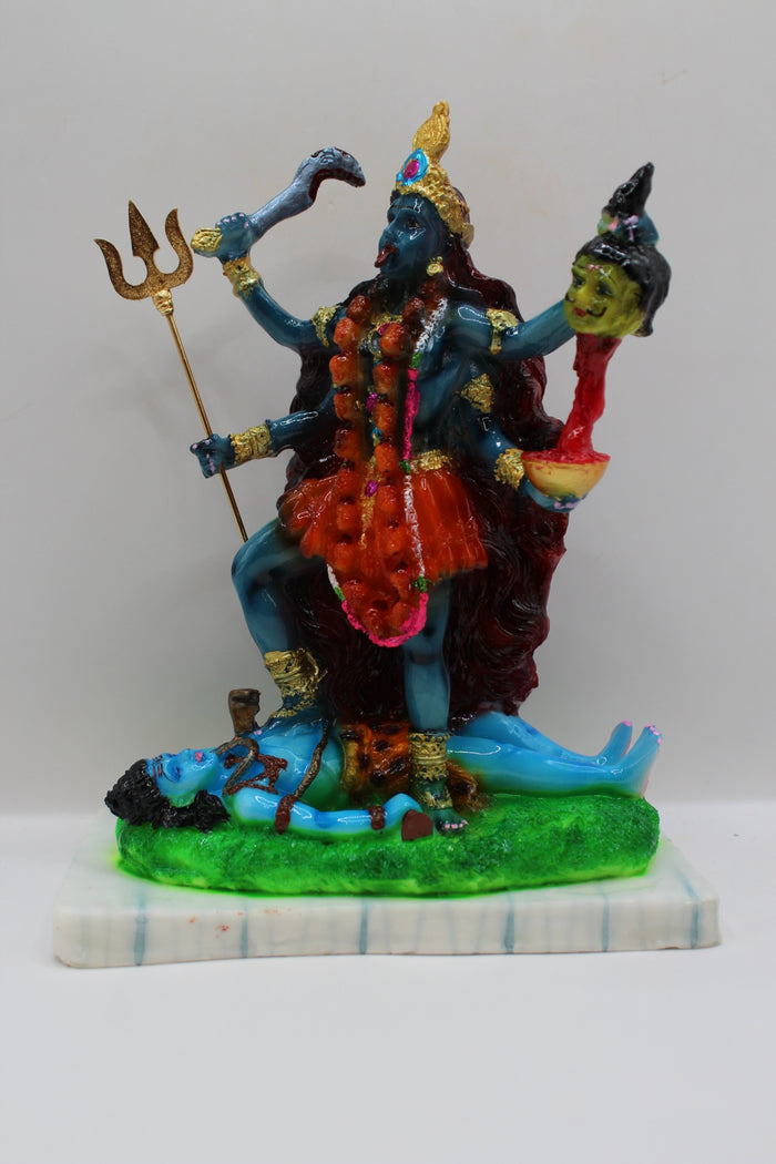 Resin Kali Mata statue, blue kali on green base, front view