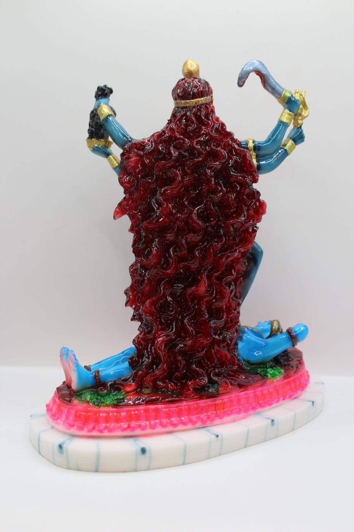 Resin Kali Mata statue, blue kali on pink base, back view