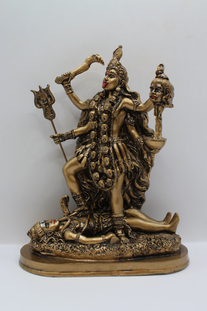 Resin Kali Mata statue, golden finish, front view