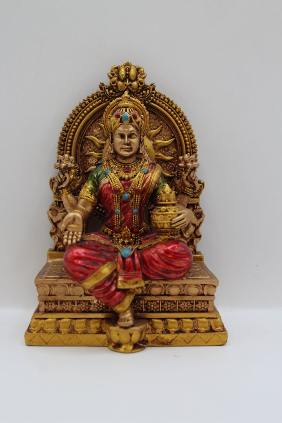 Resin Laxmi statue, seated on throne, antique bronze, front view
