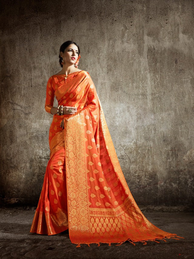 Model wearing an orange Kancheepuram saree - Shri Venilals, Wembley