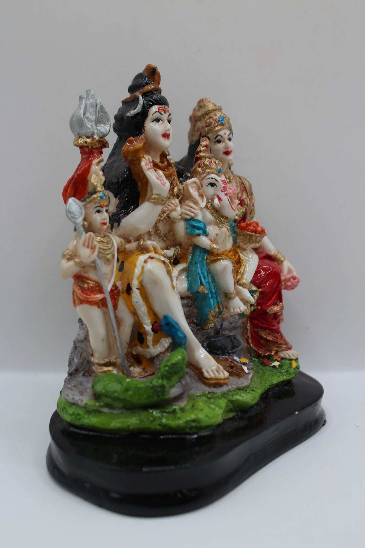 Painted resin Shiv Parivar murti, left side view