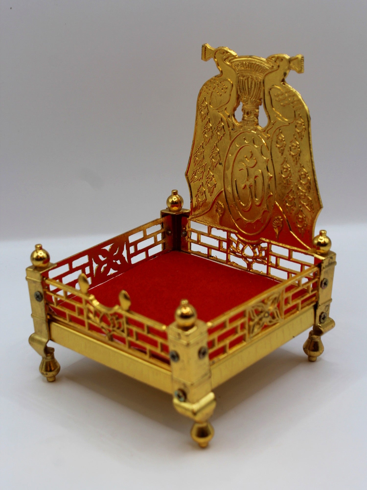 Gold metal sinhasan with red velvet seat, 10 x 10 x 15, side angle