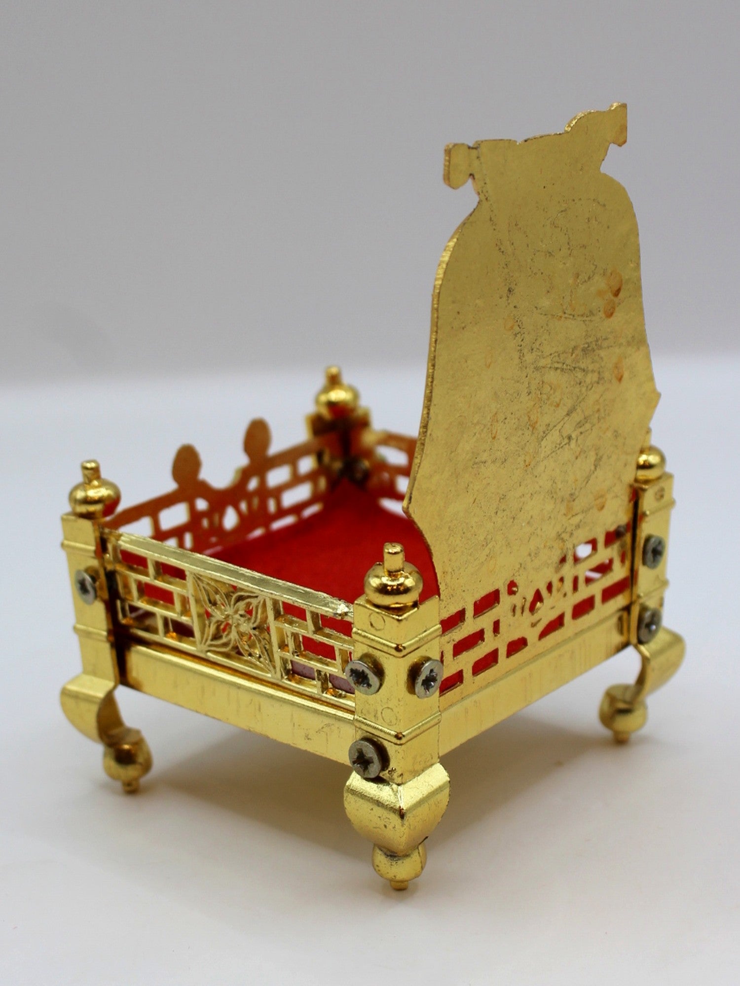 Gold metal sinhasan, 6 x 6 x 10, showing jaali sides and velvet seat