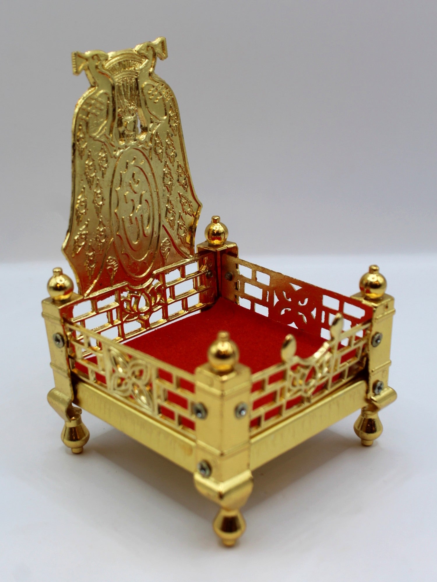 Gold metal sinhasan with red velvet seat, 9 x 9 x 15, angled view