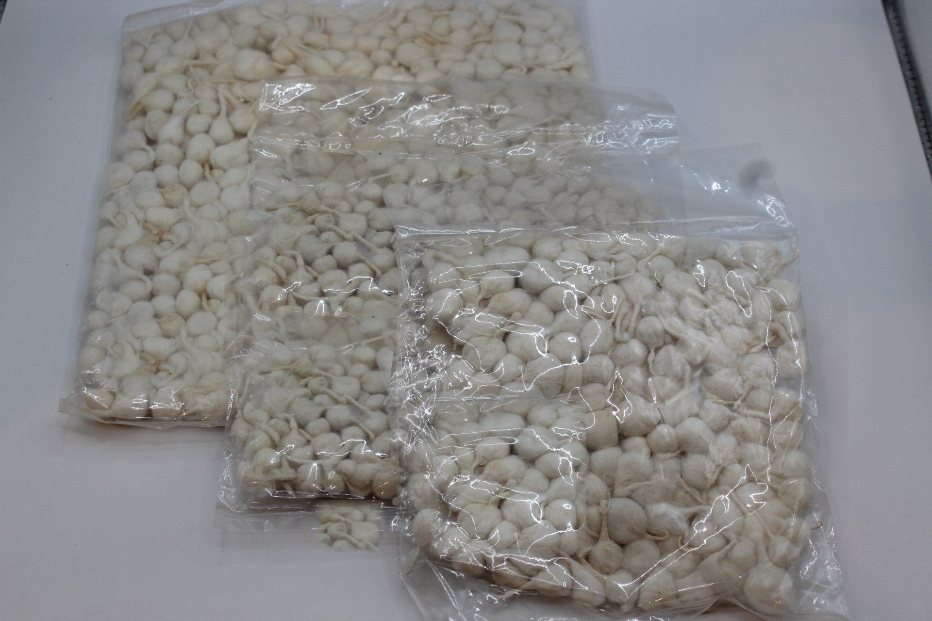 Hand-rolled cotton phool vati diya wicks in small, medium and large packs