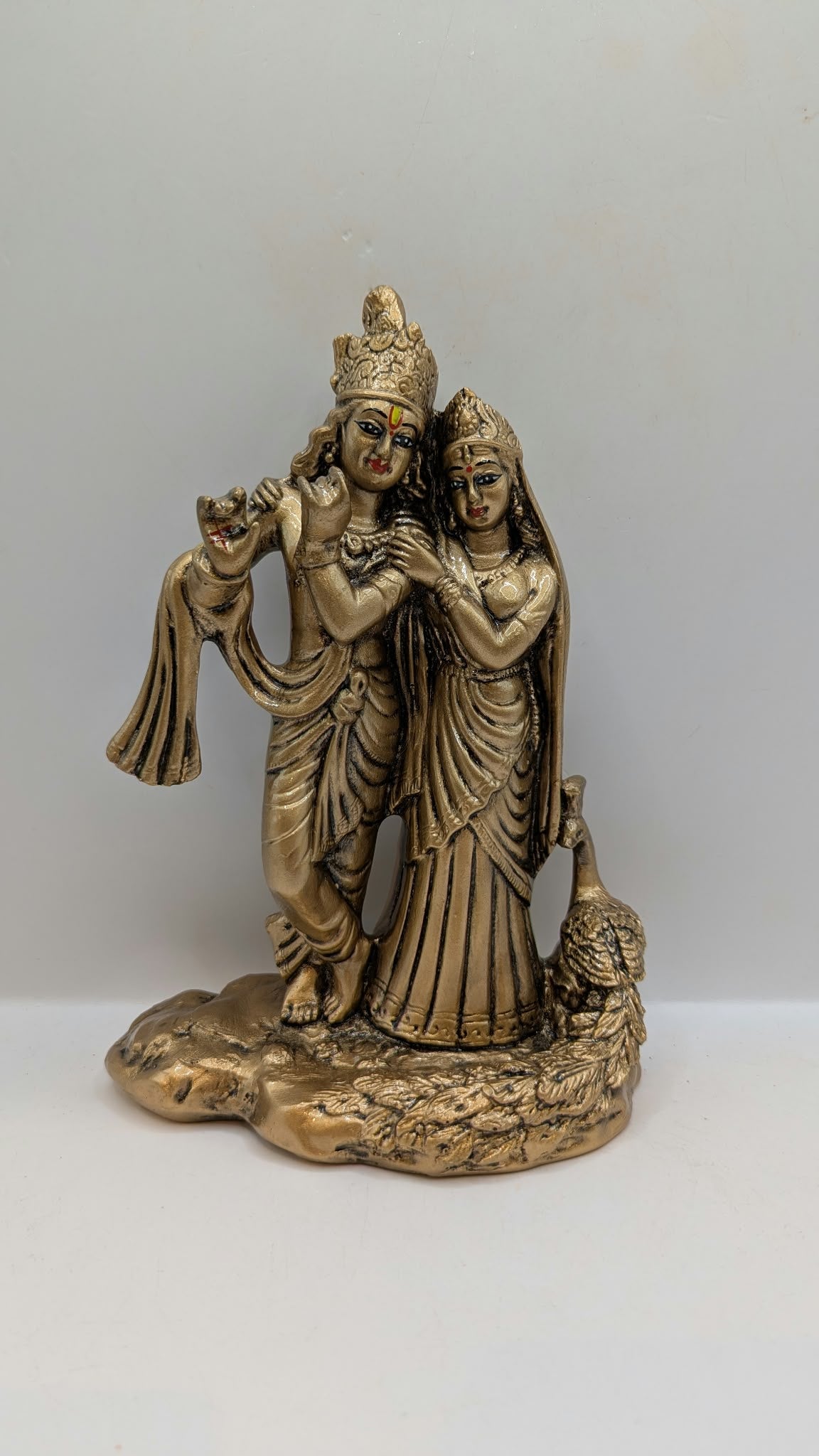 Radha Krishna statue in antique gold finish, front view