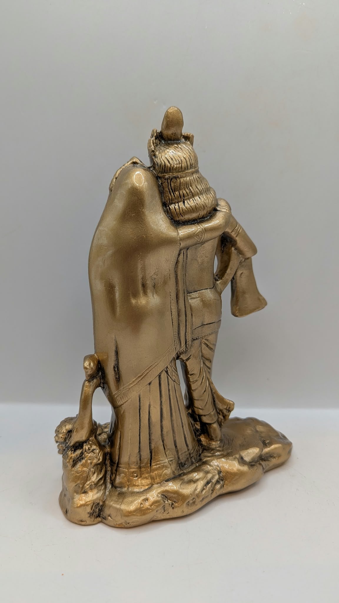 Radha Krishna statue in antique gold finish, back view