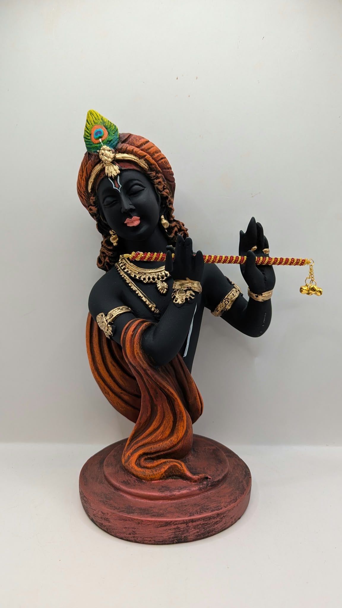 Black Lord Krishna bust statue with flute, front view