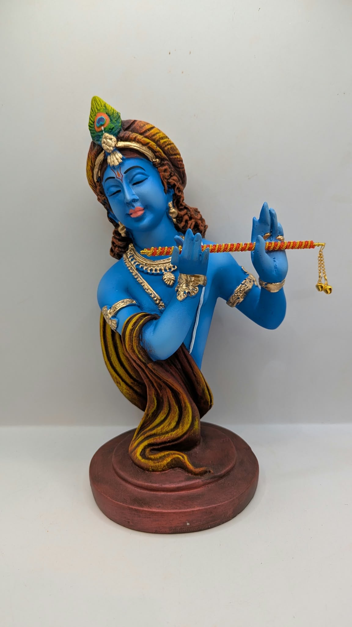 Blue Lord Krishna bust statue with flute, front view