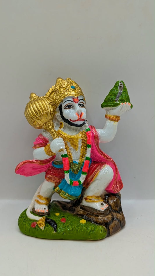 Colourful Hanuman statue with mountain and mace, front view