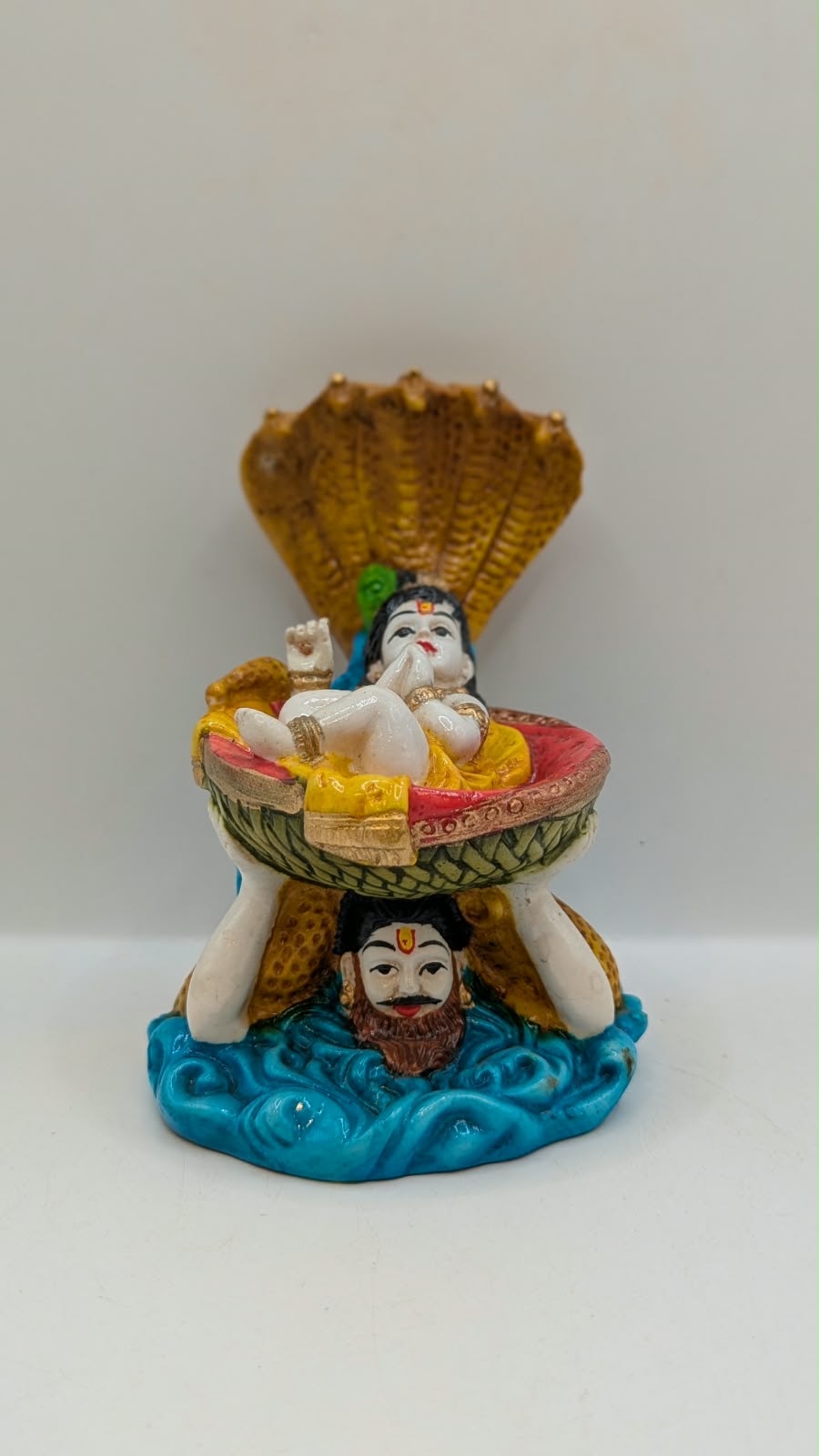 Vasudev carrying baby Krishna statue, front view
