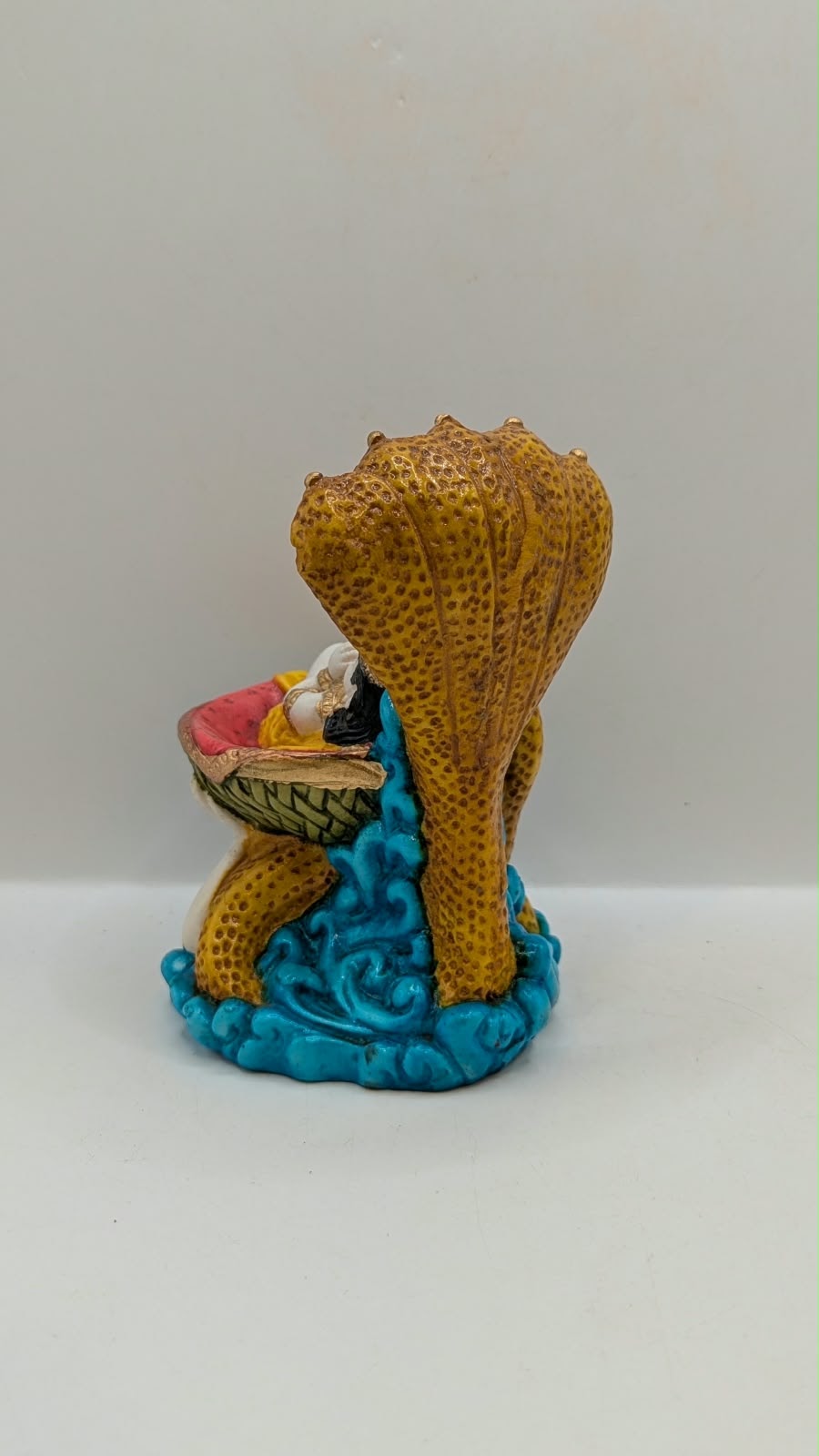 Vasudev carrying baby Krishna statue, back view